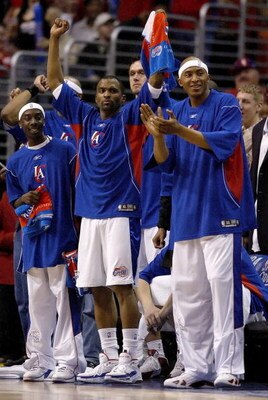 LOS ANGELES - APRIL 24:  (L-R)  Cuttino Mobley #5 and James Singleton #15 of the Los Angeles Clippers cheer from the bench as the Clippers lead the Denver Nuggets in game two of the Western Conference Quarterfinals during the 2006 NBA Playoffs on April 24