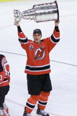 10 Jun 2000:  Bobby Holik #16 of the New Jersey Devils hoists the Stanley Cup after winning Game Six of the 2000 NHL Stanley Cup Finals between the Dallas Stars and the New Jersey Devils at Reunion Arena in Dallas, Texas.  The Devils defeated the Stars 2-