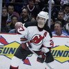 EAST RUTHERFORD, NJ - FEBRUARY 25:  Scott Niedermayer #27 of the New Jersey Devils looks to pass against the New York Rangers at Continental Airlines Arena on Febuary 25, 2003 in East Rutherford, New Jersey. The Rangers and the Devils skated to a 3-3 tie.