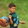 N368044 04: (MAGAZINES OUT) Elian Gonzalez gets tagged out during a kickball game April 20, 2000 in Miami. He was playing with family and friends in the yard of the home where he is staying in Miami's Little Havana district. (Photo by Joe Raedle)