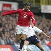 LONDON - SEPTEMBER 25:  Cristiano Renaldo of Manchester United is tackled by Pedro Mendes of Spurs during the Barclays Premiership match between Tottenham Hotspur and Manchester United on September 25, 2004 at White Hart Lane, London, England. (Photo by J