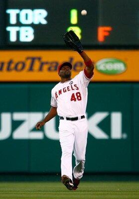 ANAHEIM, CA - JULY 07:  Torii Hunter #48 of the Los Angeles Angels of Anaheim catches a pop fly in the second inning against the Texas Rangers at Angel Stadium on July 7, 2009 in Anaheim, California. The Rangers defeated the Angels 8-5.  (Photo by Jeff Gr