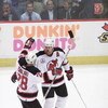 31 May 2001:   Jason Arnott #25 of the New Jersey Devils is congratulated by teammate Brian Rafalski #28 after scoring against the Colorado Avalanche in game three of the Stanley Cup finals at Continental Airlines Arena in East Rutherford, New Jersey.  Th