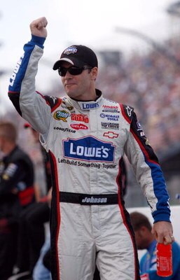 WATKINS GLEN, NY - AUGUST 10:  Jimmie Johnson, driver of the #48 Lowe's Chevrolet, walks on the grid prior to the NASCAR Sprint Cup Series Heluva Good! Sour Cream Dips at Watkins Glen International on August 10, 2009 in Watkins Glen, New York.  (Photo by 