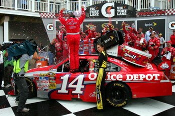 WATKINS GLEN, NY - AUGUST 10:  Tony Stewart (R), driver of the #14 Old Spice Chevrolet, celebrates in victory lane after winning the NASCAR Sprint Cup Series Heluva Good! Sour Cream Dips at Watkins Glen International on August 10, 2009 in Watkins Glen, Ne