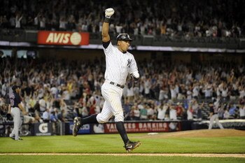 NEW YORK - AUGUST 07:  Alex Rodriguez #13 of the New York Yankees celebrates a walk off home run against the Boston Red Sox in the 15th inning on August 7, 2009 at Yankee Stadium in the Bronx borough of New York City.  The New York Yankees defeated the Bo