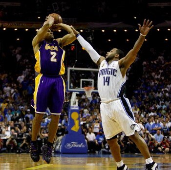 ORLANDO, FL - JUNE 11:  Derek Fisher #2 of the Los Angeles Lakers shoots a game-tying three-point shot over Jameer Nelson #14 of the Orlando Magic in the fourth quarter of Game Four of the 2009 NBA Finals on June 11, 2009 at Amway Arena in Orlando, Florid