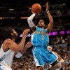 DENVER - APRIL 29:  Chris Paul #3 of the New Orleans Hornets takes a shot Nene #31 of the Denver Nuggets defends in Game Five of the Western Conference Quarterfinals during the 2009 NBA Playoffs at Pepsi Center on April 29, 2009 in Denver, Colorado. The N