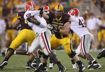 TEMPE, AZ - SEPTEMBER 20:  Tackle Jon Hargis #59 of the Arizona State Sun Devils blocks against linebacker Demarcus Dobbs #58 of the Georgia Bulldogs on September 20, 2008 at Sun Devil Stadium in Tempe, Arizona.  Georgia won 27-10.  (Photo by Stephen Dunn