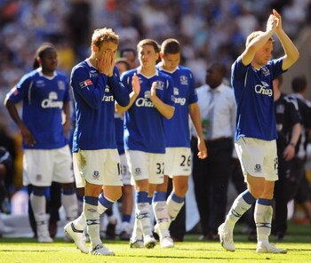 LONDON, ENGLAND - MAY 30:  Phil Neville (2L) and Everton team mates look dejected after defeat during the FA Cup sponsored by E.ON Final match between Chelsea and Everton at Wembley Stadium on May 30, 2009 in London, England.  (Photo by Shaun Botterill/Ge