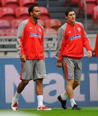 AMSTERDAM, NETHERLANDS - AUGUST 11:  Joleon Lescott walks with Gareth Barry during the England Training Session at the Amsterdam Arena on August 11, 2009 in Amsterdam, Netherlands.  (Photo by Michael Regan/Getty Images)