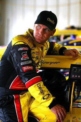 BROOKLYN, MI - AUGUST 15:  Clint Bowyer, sits on the #33 Hamburger Helper/Cheerios Chevrolet in the garage prior to practice for the NASCAR Sprint Cup Series Michigan 400 at Michigan Internetional Speedway on August 15, 2009 in Brooklyn, Michigan.  (Photo