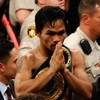 LAS VEGAS - MAY 02:  Manny Pacquiao of the Philippines celebrates after knocking out Ricky Hatton of England in the second round during their junior welterweight title fight at the MGM Grand Garden Arena May 2, 2009 in Las Vegas, Nevada.  (Photo by Ethan 