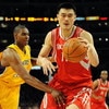 LOS ANGELES, CA - MAY 06:  Yao Ming #11 of the Houston Rockets moves the ball against Andrew Bynum #17 of the Los Angeles Lakers in Game Two of the Western Conference Semifinals during the 2009 NBA Playoffs at Staples Center on May 6, 2009 in Los Angeles,