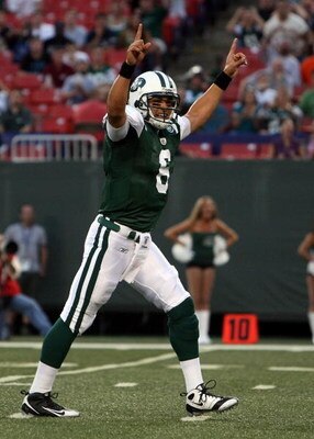 EAST RUTHERFORD, NJ - AUGUST 14:  Mark Sanchez #6 of the New York Jets celebrates his first touchdown during the preseason game against the St. Louis Rams at Giants Stadium on August 14, 2009  in East Rutherford, New Jersey.  (Photo by Nick Laham/Getty Im