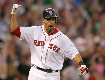 BOSTON - APRIL 25: Mike Lowell #25 of the Boston Red Sox celebrates as he rounds the bases after hitting a home run against the New York Yankees at Fenway Park, April 25, 2009, in Boston, Massachusetts. (Photo by Jim Rogash/Getty Images)