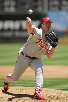 OAKLAND, CA - JUNE 19:  Jon Lieber #21 of the Philadelphia Phillies pitches against the Oakland Athletics during their interleague MLB game at McAfee Coliseum on June 19, 2005 in Oakland, California.  The Athletics won 5-2. (Photo by Jed Jacobsohn/Getty I