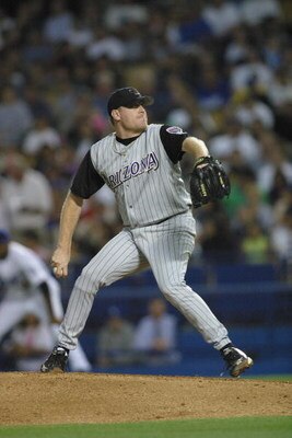 LOS ANGELES - JULY 12:  Starting Pitcher Curt Schilling #38 of the Arizona Diamondbacks throws the ball against the Los Angeles Dodgers on July 12, 2002 at Dodger Stadium in Los Angeles, California.  The Diamondbacks edged the Dodgers 3-2.  (Photo by Step