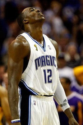 ORLANDO, FL - JUNE 11:  Dwight Howard #12 of the Orlando Magic reacts in Game Four of the 2009 NBA Finals against the Los Angeles Lakers on June 11, 2009 at Amway Arena in Orlando, Florida.  NOTE TO USER:  User expressly acknowledges and agrees that, by d