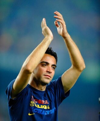 BARCELONA, SPAIN - MAY 28: Xavi Hernandez celebrates at the Nou Camp stadium the day after Barcelona won the UEFA Champions League Cup final on May 28, 2009 in Barcelona, Spain. Barcelona beat Manchester United in the final in Rome.  (Photo by Manuel Quei