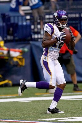 INDIANAPOLIS, IN - AUGUST 14: Wide receiver Percy Harvin #12 of the Minnesota Vikings catches the football against the Indianapolis Colts at Lucas Oil Stadium on August 14, 2009 in Indianapolis, Indiana. (Photo by Scott Boehm/Getty Images)