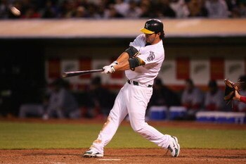 OAKLAND, CA - JUNE 04:  Eric Chavez #3 of the Oakland Athletics hits a walk off home run in the 11th inning against the Boston Red Sox during a Major League Baseball game on June 4, 2007 at McAfee Coliseum in Oakland, California.  (Photo by Jed Jacobsohn/