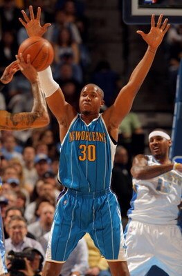 DENVER - APRIL 19:  David West #30 of the New Orleans Hornets defends against the Denver Nuggets in Game One of the Western Conference Quarterfinals during the 2009 NBA Playoffs at Pepsi Center on April 19, 2009 in Denver, Colorado. The Nuggets defeated t