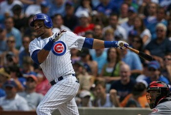 CHICAGO - JULY 26: Aramis Ramirez #16 of the Chicago Cubs hits a run-scoring double in the 7th inning against the Cincinnati Reds on July 26, 2009 at Wrigley Field in Chicago, Illinois. The Cubs defeated the Reds 5-2.  (Photo by Jonathan Daniel/Getty Imag