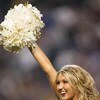 MINNEAPOLIS - DECEMBER 2:  A cheerleader of the Minnesota Vikings carries the ball during the NFL game against the Detroit Lions at the Metrodome on December 2, 2007 in Minneapolis, Minnesota. (Photo by Stephen Dunn/Getty Images)