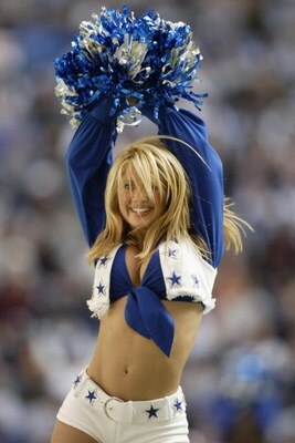 IRVING, TEXAS - DECEMBER 21:  A Dallas Cowboys Cheerlearder dances during the game against the New York Giants at Texas Stadium on December 21, 2003 in Irving, Texas. The Cowboys defeated the Giants 19-3. (Photo by Ronald Martinez/Getty Images)