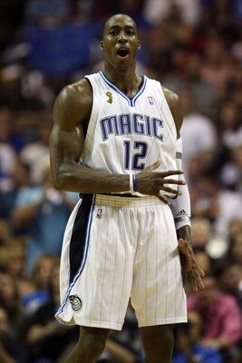 ORLANDO, FL - JUNE 11:  Dwight Howard #12 of the Orlando Magic reacts in the second half of Game Four of the 2009 NBA Finals against the Los Angeles Lakers on June 11, 2009 at Amway Arena in Orlando, Florida.  NOTE TO USER:  User expressly acknowledges an