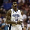 ORLANDO, FL - JUNE 11:  Dwight Howard #12 of the Orlando Magic reacts in the second half of Game Four of the 2009 NBA Finals against the Los Angeles Lakers on June 11, 2009 at Amway Arena in Orlando, Florida.  NOTE TO USER:  User expressly acknowledges an