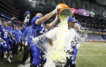 DETROIT - DECEMBER 05: Head coach Turner Gill of the Buffalo Bulls is showered with Gatorade by Peter Bittner #73 late in the fourth quarter during the MAC Championship game against the Ball State Cardinals on December 5, 2008 at Ford Field in Detroit, Mi