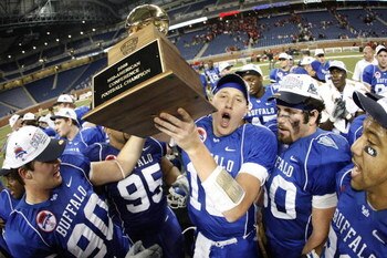 DETROIT - DECEMBER 05: Drew Willy #16 of the Buffalo Bulls celebrates the MAC Championship with teammates after defeating the Ball State Cardinals on December 5, 2008 at Ford Field in Detroit, Michigan. (Photo by Gregory Shamus/Getty Images)