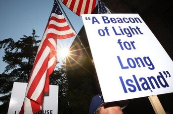 UNIONDALE, NY - AUGUST 04:  Fans rally for support at Lot 8 of the Nassau Coliseum prior to marching to the Lighthouse project public hearing at the Adams Playhouse on the campus of Hofstra University on August 4, 2009  in Uniondale, New York.  (Photo by 