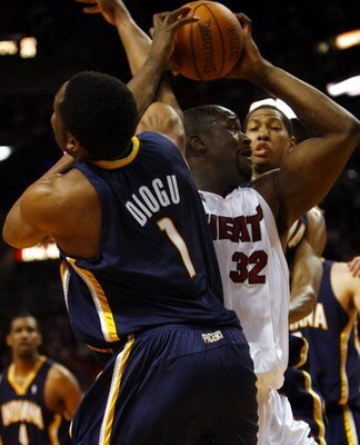 MIAMI - APRIL 13: Shaquille O'Neal #32 of the Miami Heat tangles with Ike Diogu #1 of the Indiana Pacers on April 13, 2007 at the American Airlines Arena in Miami  Florida. NOTE TO USER: User expressly acknowledges and agrees that, by downloading and/or u