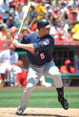 ANAHEIM, CA - JULY 26:  Michael Cuddyer #5 of the Minnesota Twins at bat against the Los Angeles Angels of Anaheim at Angels Stadium on July 26, 2009 in Anaheim, California. (Photo by Harry How/Getty Images