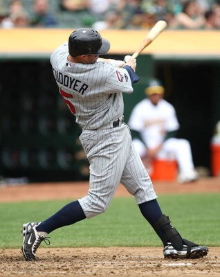 OAKLAND, CA - JUNE 11:  Michael Cuddyer #5 of the Minnesota Twins bats  against the Oakland Athletics during a Major League Baseball game on June 11, 2009 at the Oakland Coliseum in Oakland, California.  (Photo by Jed Jacobsohn/Getty Images)