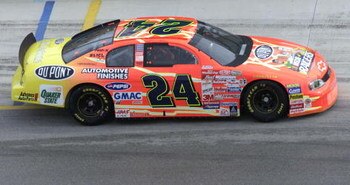 Top NASCAR Winston Cup series driver Jeff Gordon drives one of the 'NASCAR RACERS'-themed cars, unveiled Thursday, November 11th at the start of the Pennzoil 400 weekend at Homestead-Miami Speedway as NASCAR and the Fox Kids Network celebrated the premier
