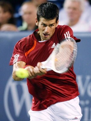 CINCINNATI - AUGUST 22:  Novak Djokovic of Serbia hits a backhand against Rafael Nadal of Spain in their semi final during day six of the Western & Southern Financial Group Masters on August 22, 2009 at the Lindner Family Tennis Center in Cincinnati, Ohio