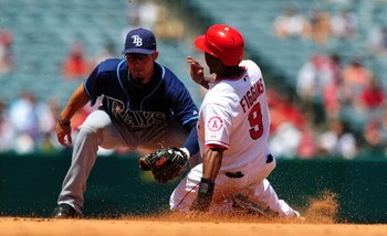 ANAHEIM, CA - AUGUST 12:  Chone Figgins #9 of the Los Angeles Angels steals second base in Major League Baseball action against the Tampa Bay Rays on August 12, 2009 in Anaheim, California.  (Photo by Jacob de Golish/Getty Images)