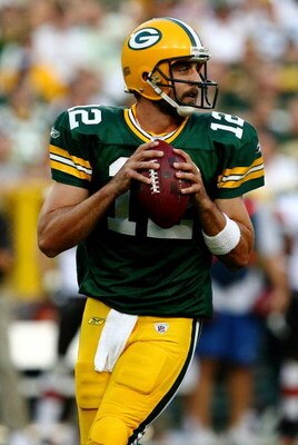 GREEN BAY, WI - AUGUST 15:  Quarterback Aaron Rodgers #12 of the Green Bay Packers looks to pass against the Cleveland Browns during the preseason game at Lambeau Field on August 15, 2009 in Green Bay, Wisconsin.  (Photo by Jonathan Daniel/Getty Images)