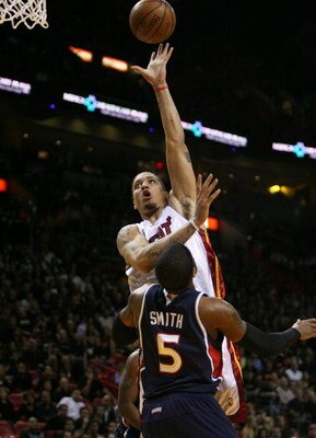 MIAMI - MAY 01:  Michael Beasley #30 of the Miami Heat scores over Josh Smith #5 of the Atlanta Hawks during Game Six of the Eastern Conference Quarterfinals at American Airlines Arena on May 1, 2009 in Miami, Florida. NOTE TO USER: User expressly acknowl