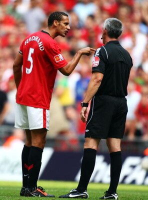 LONDON, ENGLAND - AUGUST 09:  Rio Ferdinand of Manchester United argues with referee Chris Foy following Frank Lampard's goal for Chelsea during the FA Community Shield match between Manchester United and Chelsea at Wembley Stadium on August 9, 2009 in Lo