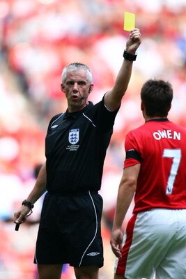 LONDON, ENGLAND - AUGUST 09:  CMichael Owen of Manchester United is booked by referee Chris Foy during the FA Community Shield match between Manchester United and Chelsea at Wembley Stadium on August 9, 2009 in London, England.  (Photo by Phil Cole/Getty 
