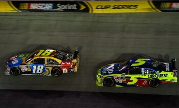 BRISTOL, TN - AUGUST 22:  Kyle Busch, driver of the #18 M&M's Toyota, leads Mark Martin, driver of the #5 Pop Tarts/CARQUEST Chevrolet, in the last laps of the NASCAR Sprint Cup Series Sharpie 500 at Bristol Motor Speedway on August 22, 2009 in Bristol, T