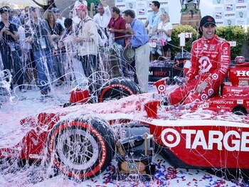 SONOMA, CA - AUGUST 23:  Dario Franchitti, driver of the #10 Target Chip Ganassi Racing Dallara Honda, is showered with silly string after winning the IRL IndyCar Series Indy Grand Prix of Sonoma at the Infineon Raceway on August 23, 2009 in Sonoma, Calif