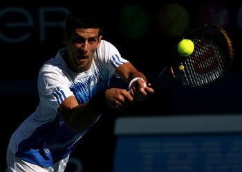 MELBOURNE, AUSTRALIA - JANUARY 23:  Novak Djokovic of Serbia prepares to return serve during his quarter-final match against David Ferrer of Spain on day ten of the Australian Open 2008 at Melbourne Park on January 23, 2008 in Melbourne, Australia.  (Phot