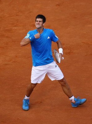ROME - MAY 02:  Novak Djokovic of Serbia celebrates defeating Roger Federer of Switzerland during their semi-final match on day six of the Foro Italico Tennis Masters on May 2, 2009 in Rome, Italy.  (Photo by Julian Finney/Getty Images)