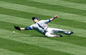 LOS ANGELES, CA - AUGUST 23:  Center fielder Sam Fuld #27 of the Chicago Cubs can't make a catch on a ball hit by Andre Ethier of the Los Angeles Dodgers in the first inning at Dodger Stadium on August 23, 2009 in Los Angeles, California.  (Photo by Jeff 